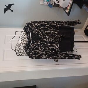 Black and white womens top with fitted waist